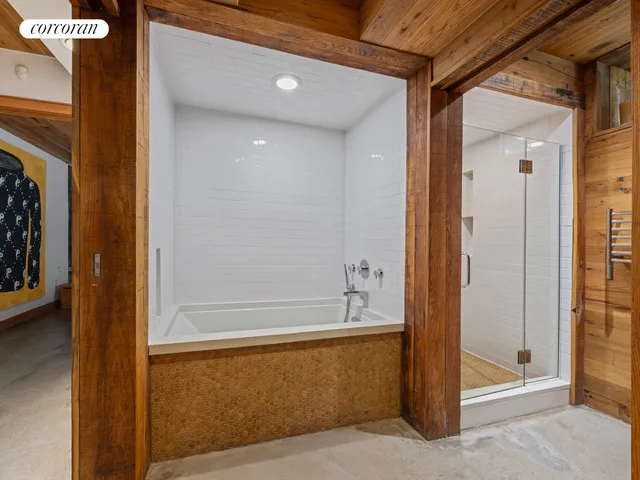 a bedroom with a bed and a mirror