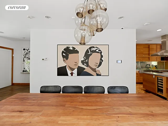 a kitchen with stainless steel appliances a stove a sink dishwasher and a refrigerator