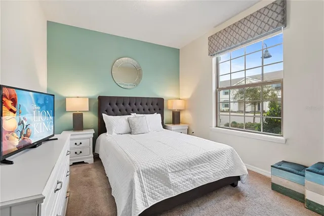 a bedroom with a bed and window