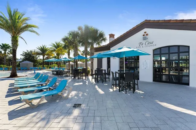 a view of a swimming pool with a yard