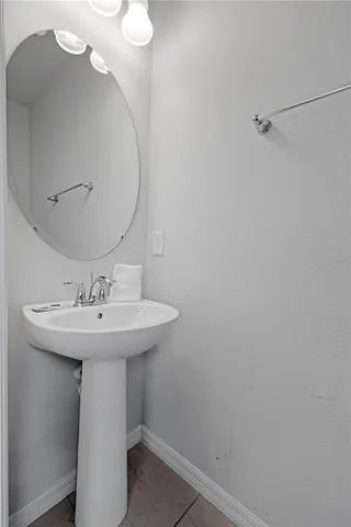 a bathroom with a sink a mirror and shower