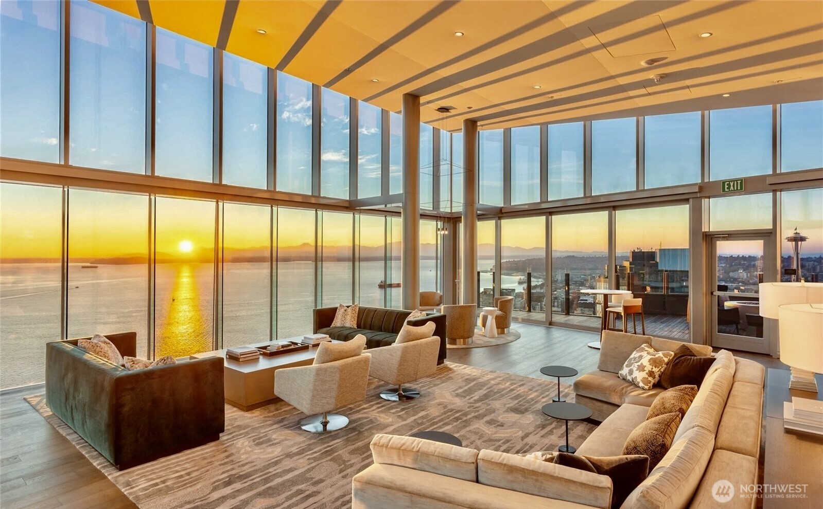 a living room with furniture city view and large windows