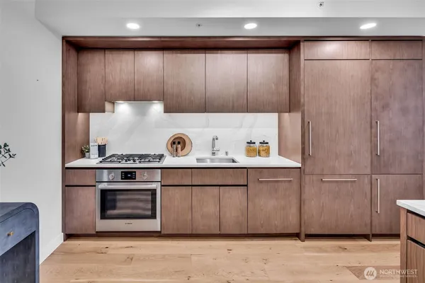a kitchen with a stove and cabinets