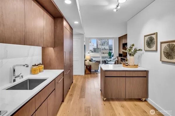 a kitchen with sink and refrigerator