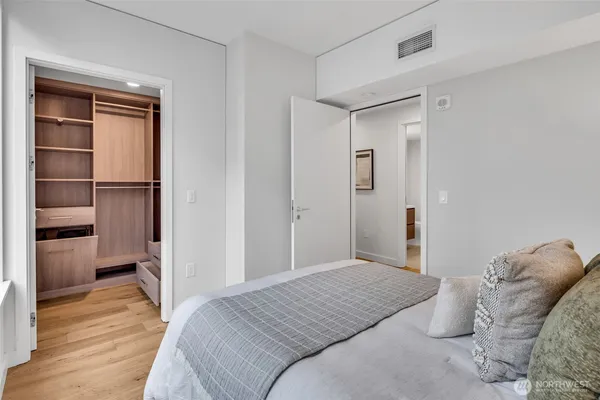 a bedroom with a bed and a view of bathroom