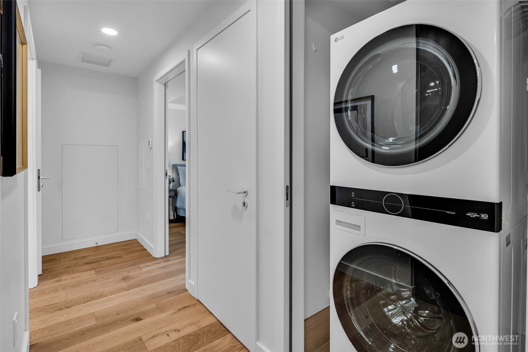 121 Stewart Street, Unit 1003 Seattle, WA 98101 - Photo 28 of 40 a view of a hallway with washer and dryer