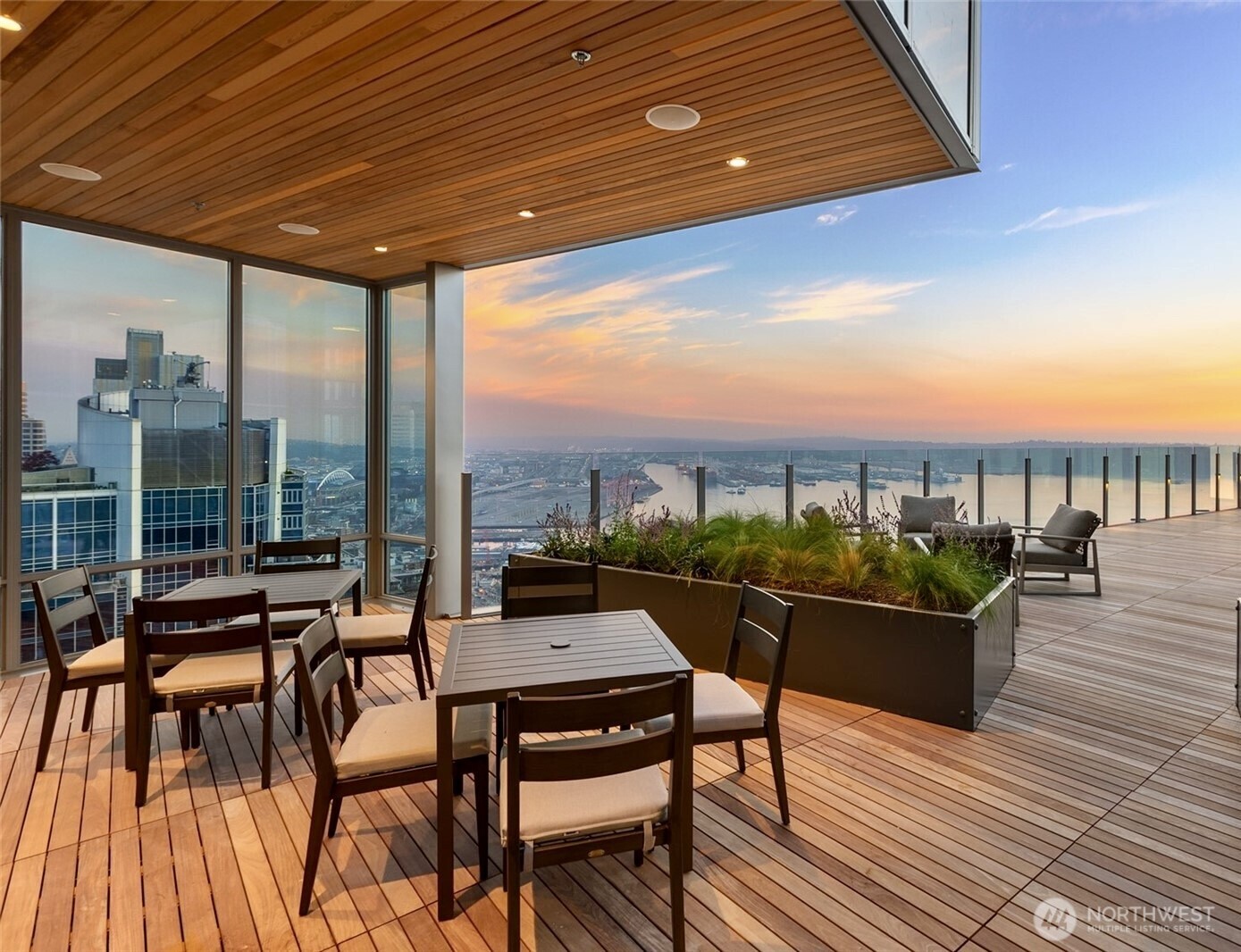 121 Stewart Street, Unit 1003 Seattle, WA 98101 - Photo 3 of 40 a living room with furniture and a floor to ceiling window