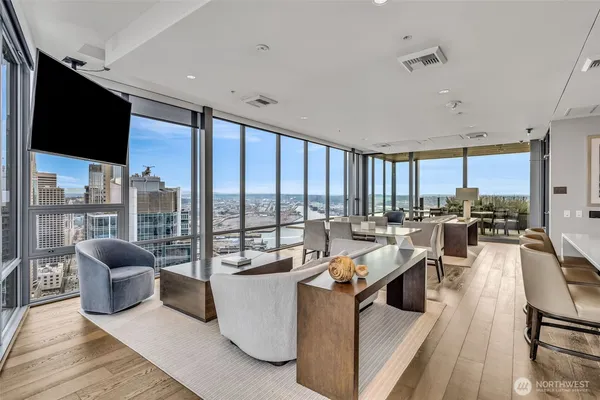 a very nice looking living room with a large window and a flat screen tv
