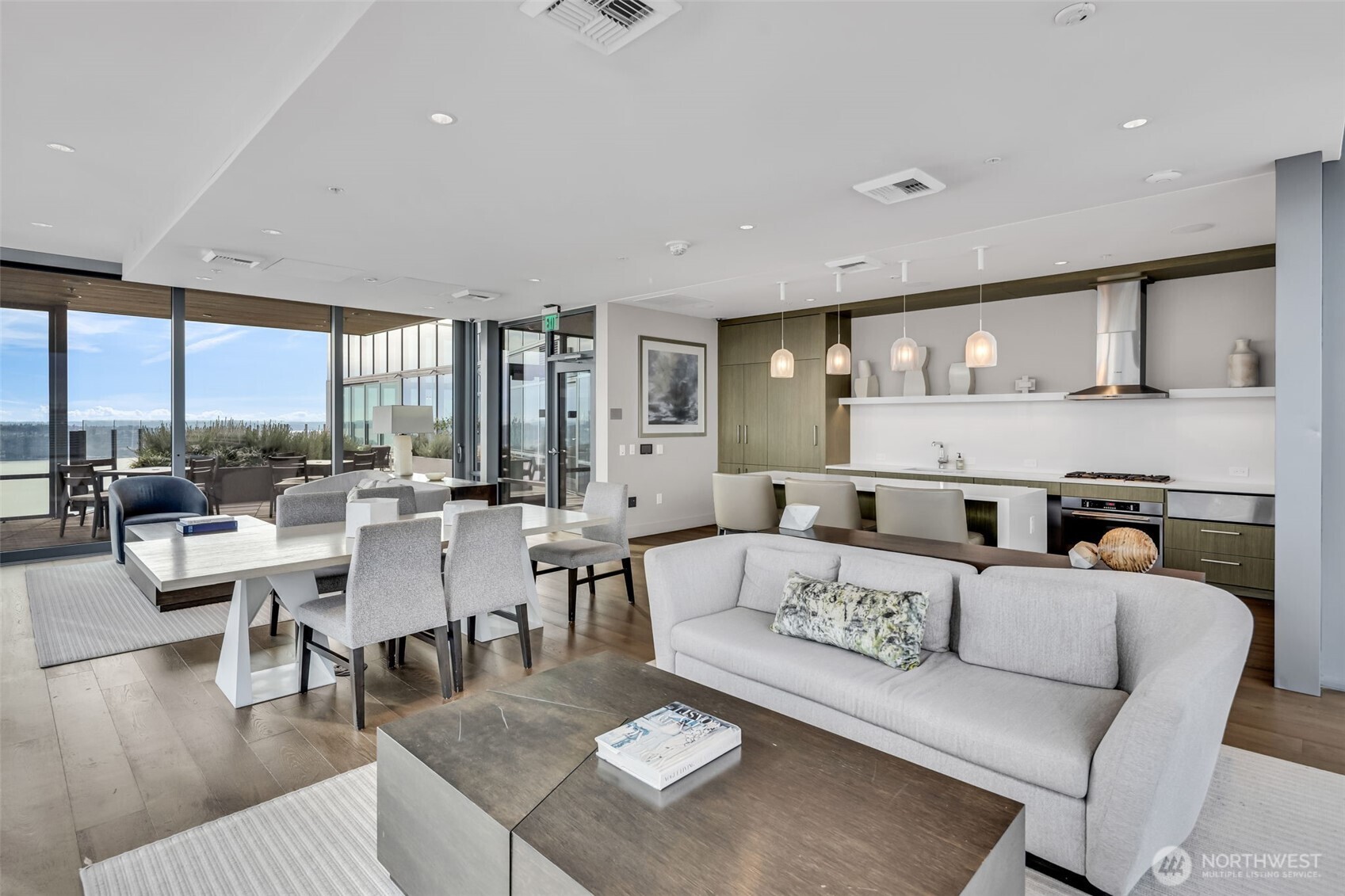 121 Stewart Street, Unit 1003 Seattle, WA 98101 - Photo 33 of 40 a living room with furniture kitchen view and a large window