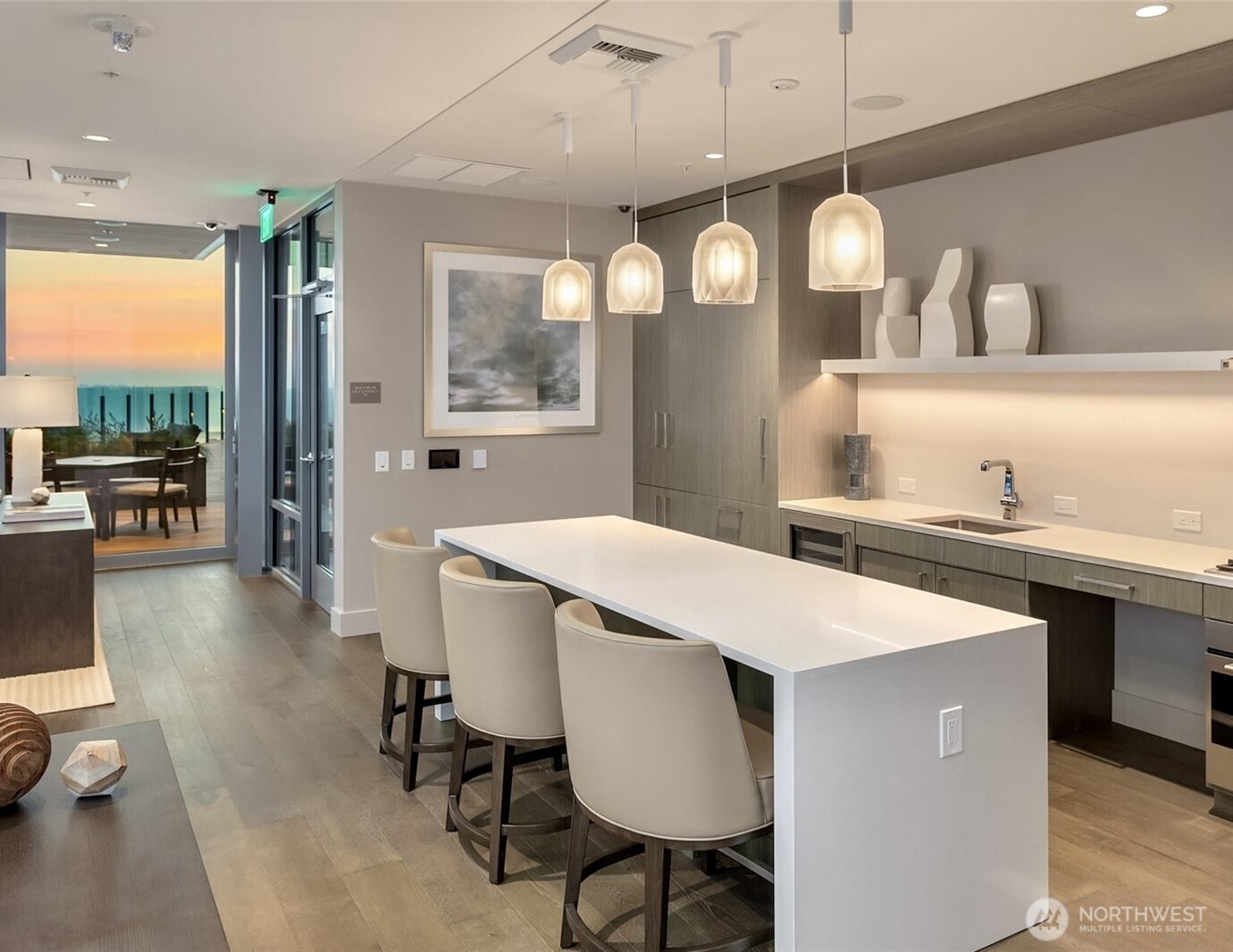 121 Stewart Street, Unit 1003 Seattle, WA 98101 - Photo 37 of 40 a large kitchen with a table and chairs