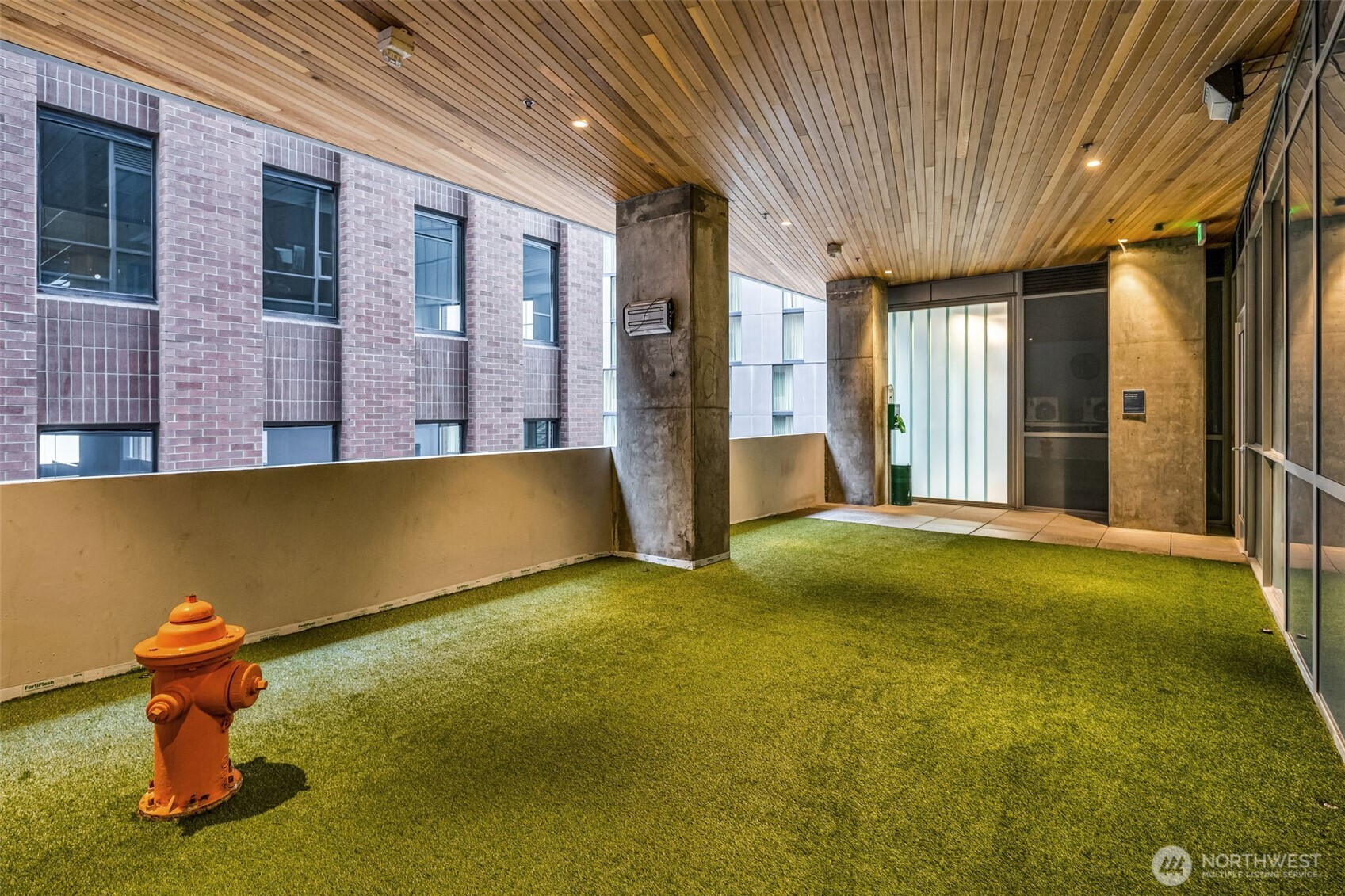 121 Stewart Street, Unit 1003 Seattle, WA 98101 - Photo 37 of 40 a view of swimming pool with an outdoor space and seating area