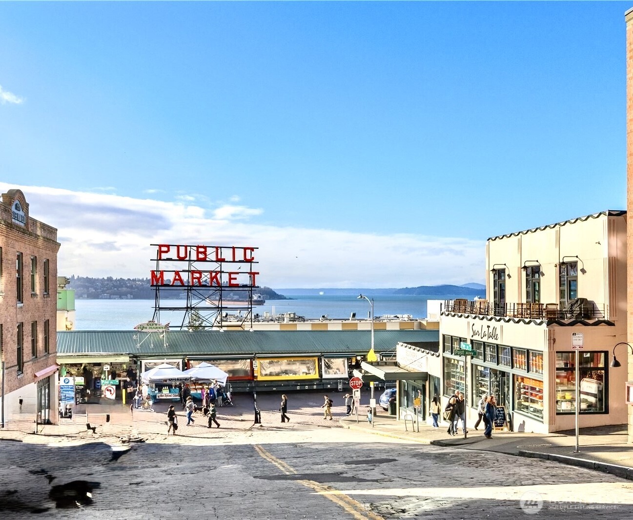 121 Stewart Street, Unit 1003 Seattle, WA 98101 - Photo 39 of 40 a view of a swimming pool with outdoor seating