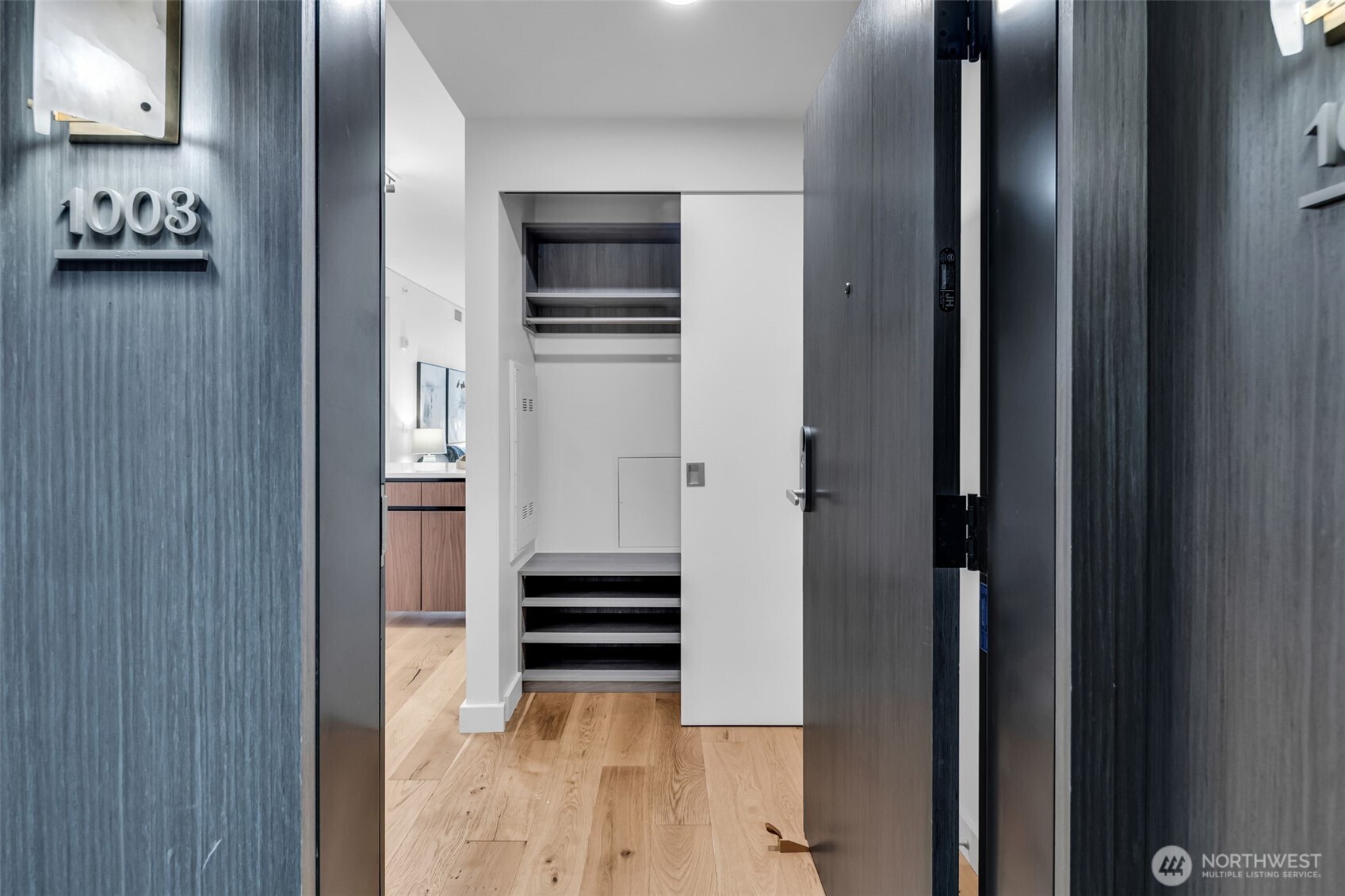 121 Stewart Street, Unit 1003 Seattle, WA 98101 - Photo 8 of 40 a view of kitchen with stainless steel appliances and chandelier