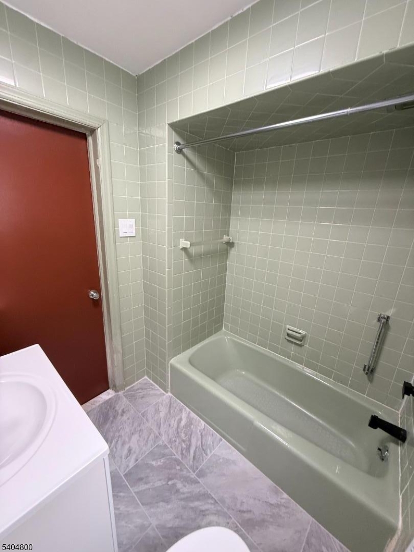 200 North 15th Street, Unit 1 Bloomfield, NJ 07003 - Photo 11 of 13 a bathroom with a bathtub and shower