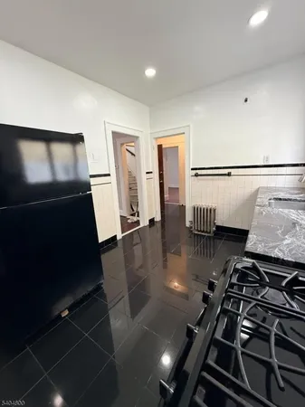 a kitchen with a stove and a refrigerator