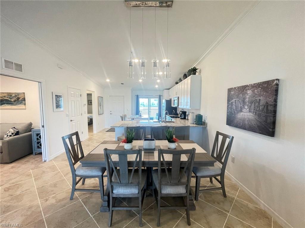 16000 Grassland Lane, Unit 3127 Babcock Ranch, FL 33982 - Photo 12 of 44 a view of a dining room with furniture