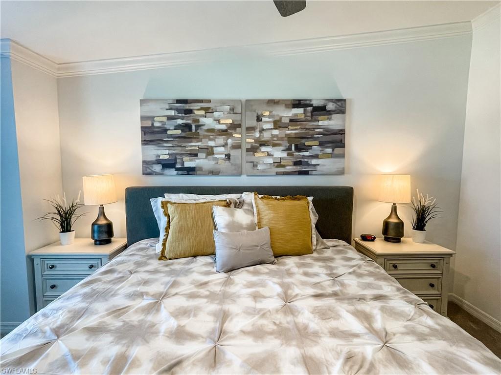 16000 Grassland Lane, Unit 3127 Babcock Ranch, FL 33982 - Photo 13 of 44 a bedroom with a bed and a large mirror