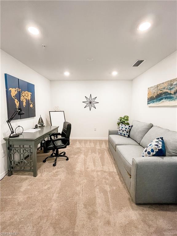 16000 Grassland Lane, Unit 3127 Babcock Ranch, FL 33982 - Photo 19 of 44 a living room with furniture and painting on the wall