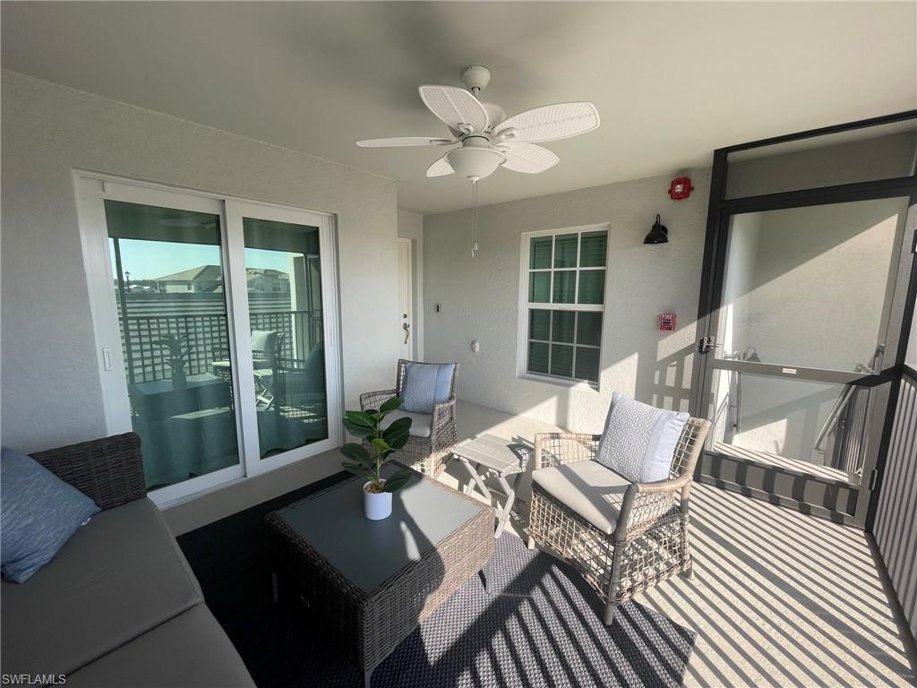 16000 Grassland Lane, Unit 3127 Babcock Ranch, FL 33982 - Photo 26 of 44 a living room with furniture and a large window