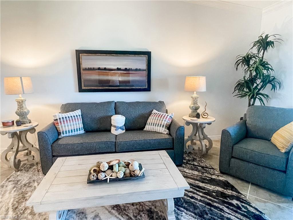 16000 Grassland Lane, Unit 3127 Babcock Ranch, FL 33982 - Photo 5 of 44 a living room with furniture a rug and a potted plant
