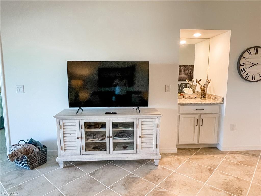 16000 Grassland Lane, Unit 3127 Babcock Ranch, FL 33982 - Photo 7 of 44 a living room with furniture and a flat screen tv