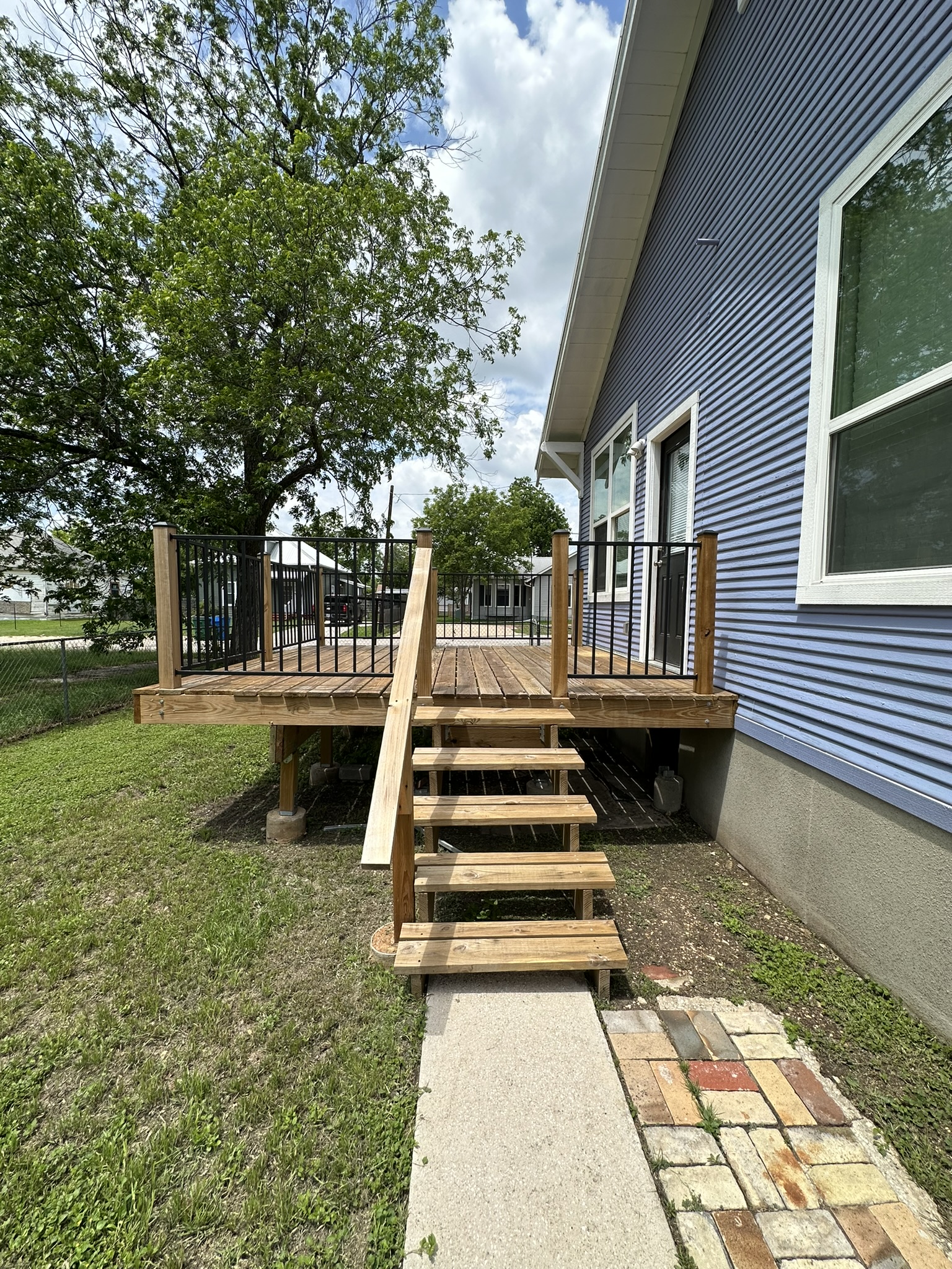 719 West 3rd Street Taylor, TX 76574 - Photo 22 of 31 View of wooden deck