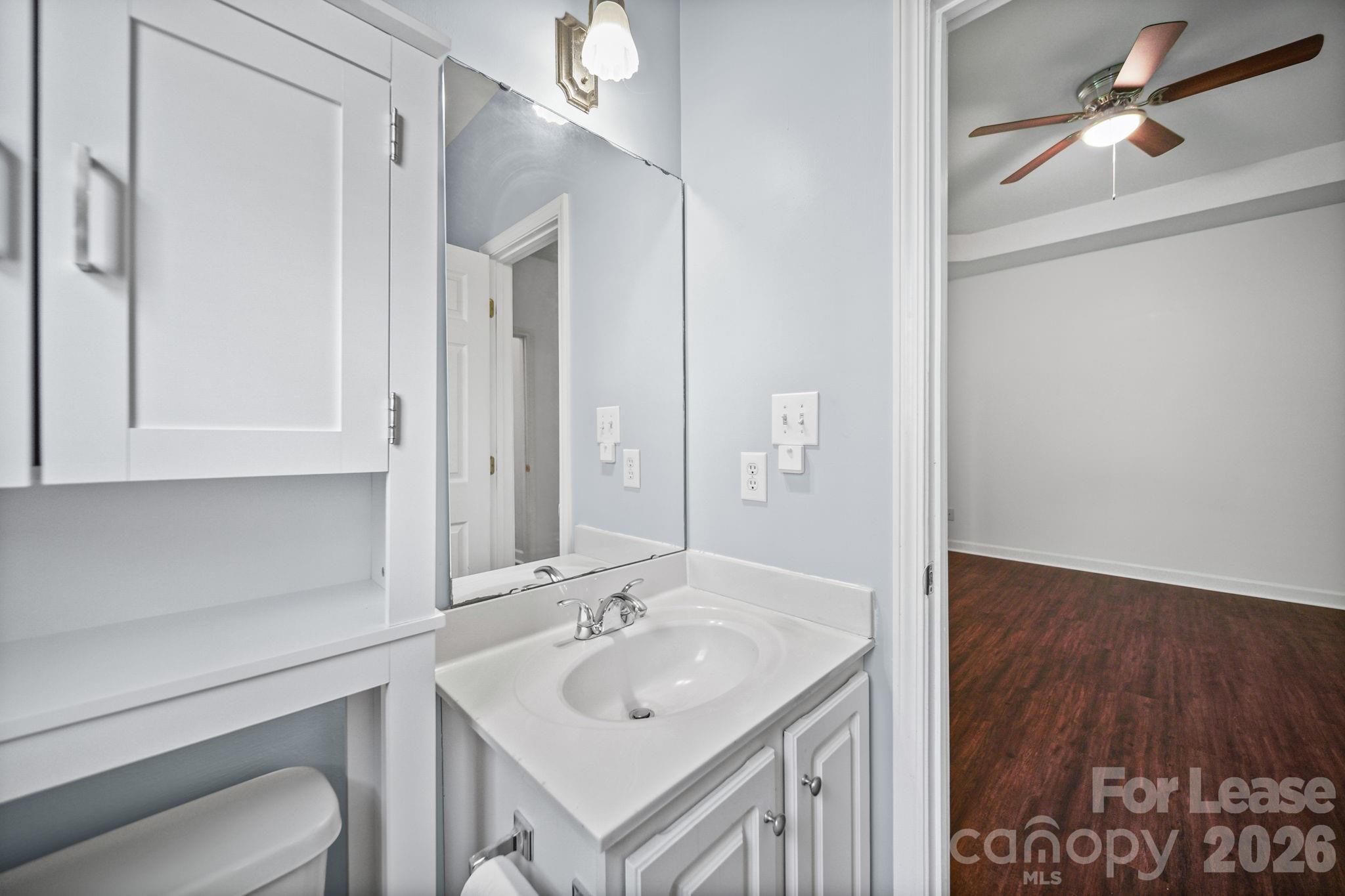 1728 Brian William Road Charlotte, NC 28212 - Photo 11 of 15 a bathroom with a sink a toilet and a mirror