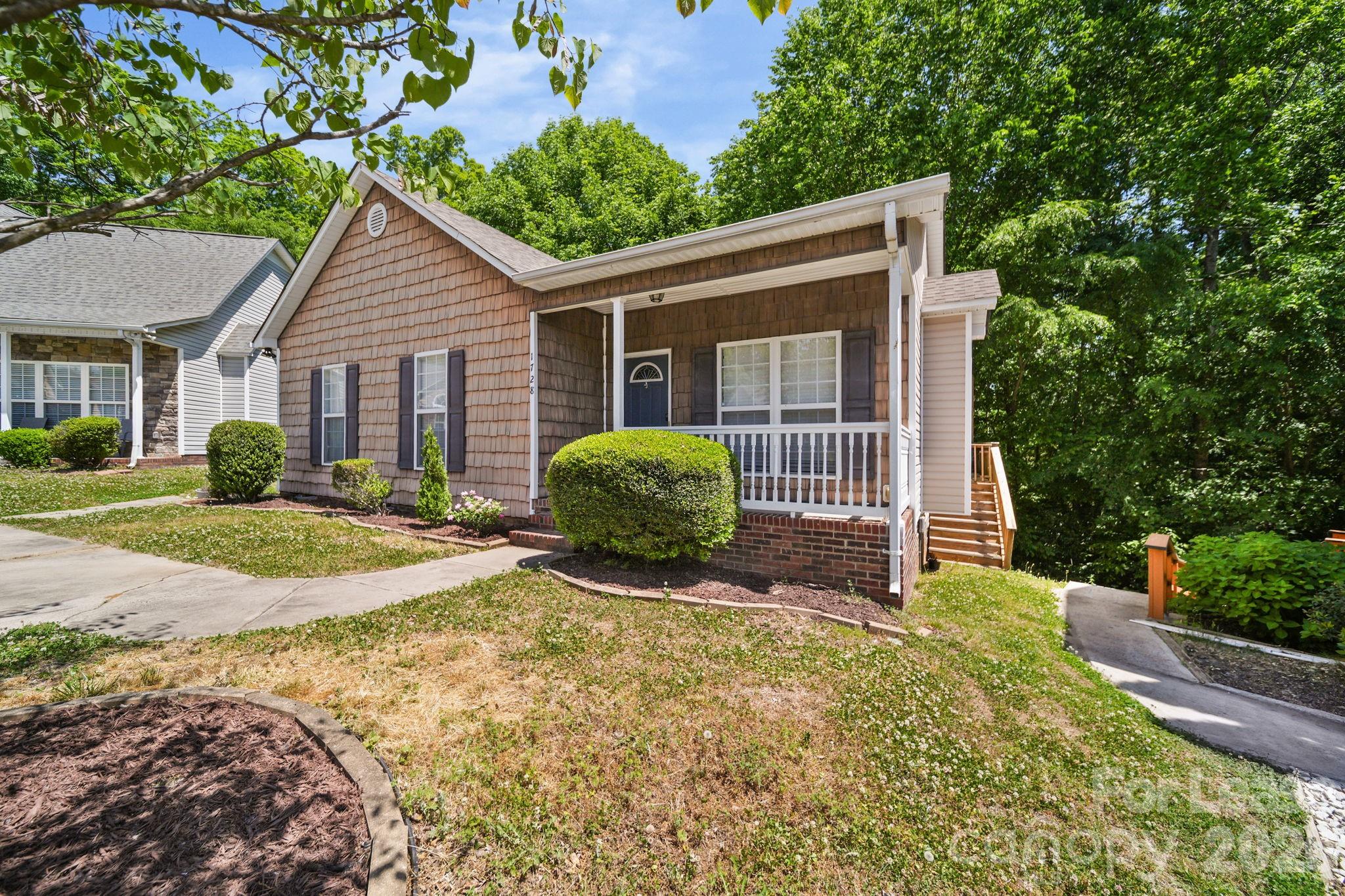 1728 Brian William Road Charlotte, NC 28212 - Photo 14 of 15 a view of a house with backyard and trees