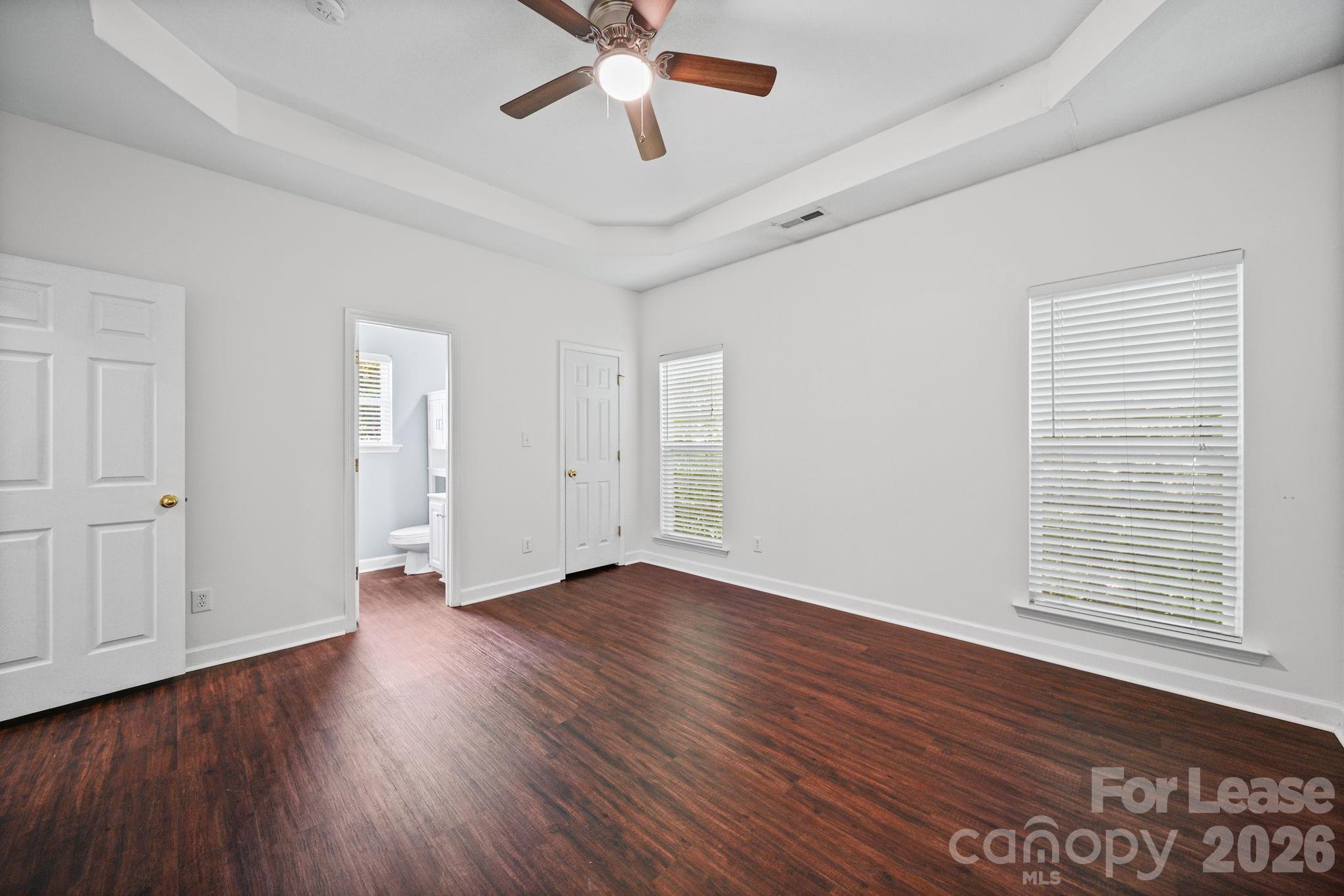 1728 Brian William Road Charlotte, NC 28212 - Photo 7 of 15 a view of an empty room with wooden floor and a window