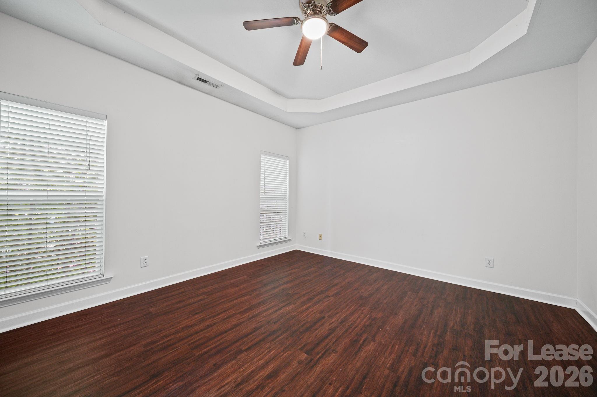1728 Brian William Road Charlotte, NC 28212 - Photo 8 of 15 a view of an empty room with wooden floor and a window