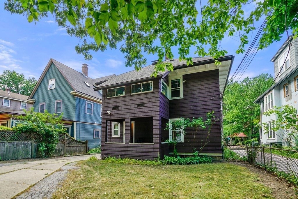 23 Stetson Street, Unit ONE Brookline, MA 02446 - Photo 13 of 15 front view of house with a yard