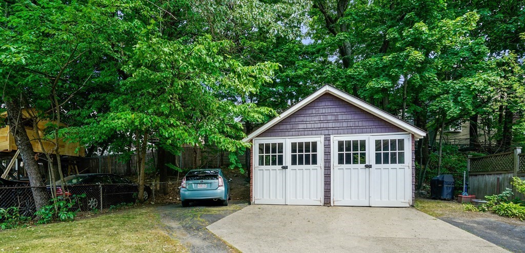 23 Stetson Street, Unit ONE Brookline, MA 02446 - Photo 14 of 15 a front view of a house with a garden