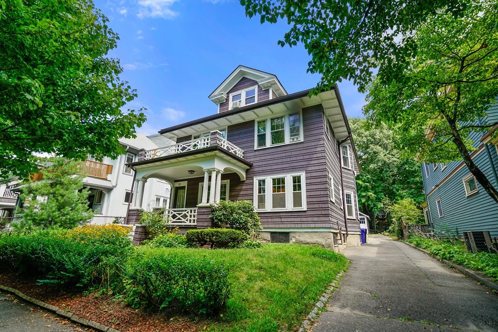 23 Stetson Street, Unit ONE Brookline, MA 02446 - Photo 15 of 15 a front view of a house with a garden
