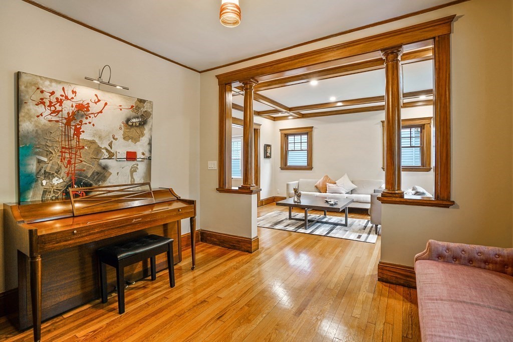 23 Stetson Street, Unit ONE Brookline, MA 02446 - Photo 2 of 15 a living room with furniture and a piano