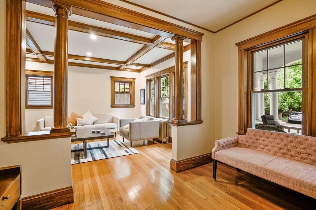 23 Stetson Street, Unit ONE Brookline, MA 02446 - Photo 3 of 15 a bedroom with furniture and a large window