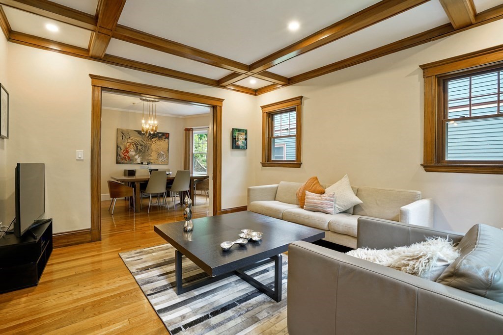 23 Stetson Street, Unit ONE Brookline, MA 02446 - Photo 4 of 15 a living room with furniture and a flat screen tv