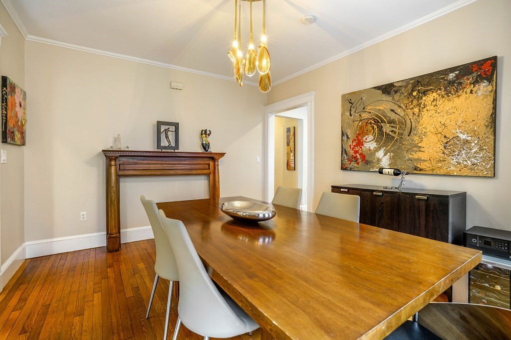 23 Stetson Street, Unit ONE Brookline, MA 02446 - Photo 5 of 15 a view of a dining room with furniture and wooden floor