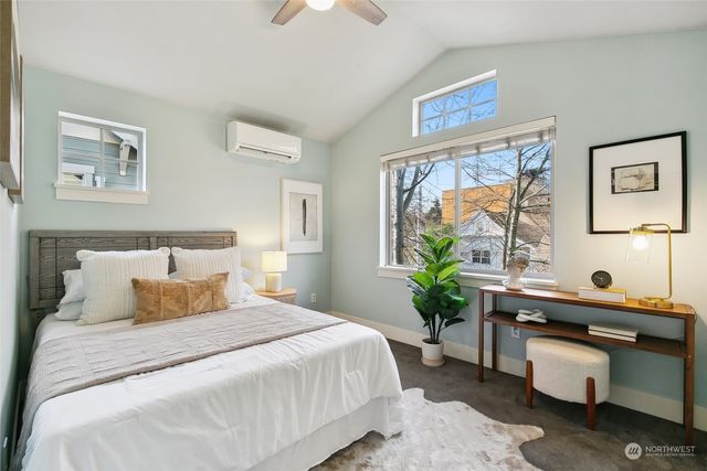 a bedroom with a bed and a desk