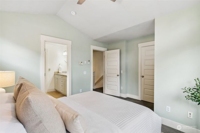 a bedroom with a bed and a mirror