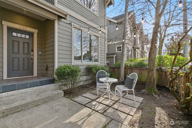 a view of a patio with couple of chairs and a couch