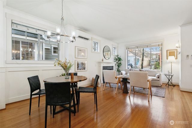 a view of a dining room with furniture window and wooden floor