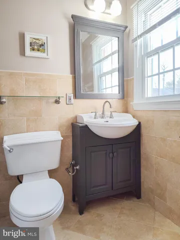 a bathroom with a toilet a sink and a bathtub