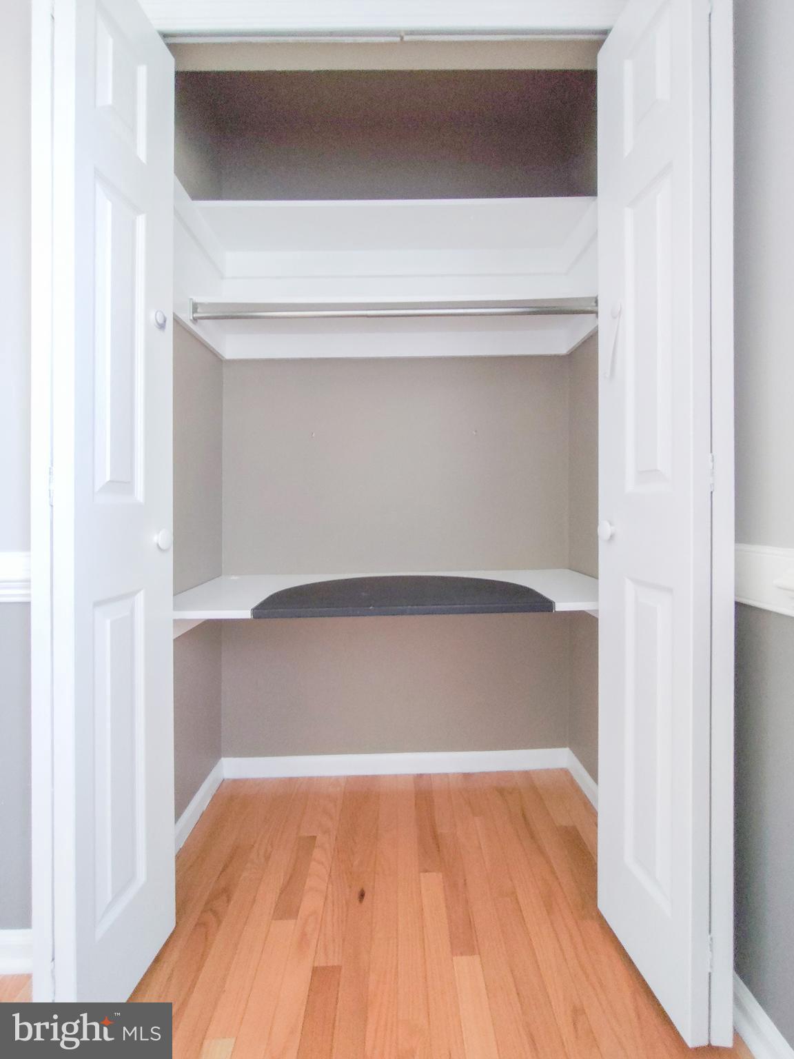 9513 Cherry Oak Court Burke, VA 22015 - Photo 30 of 40 a view of walk in closet with wooden floor