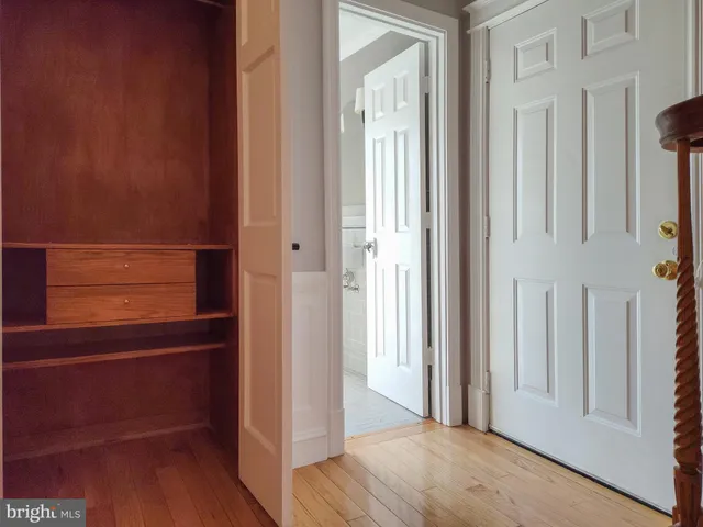 a view of front door with wooden floor