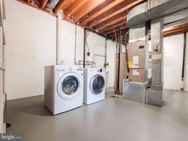 a utility room with dryer and washer