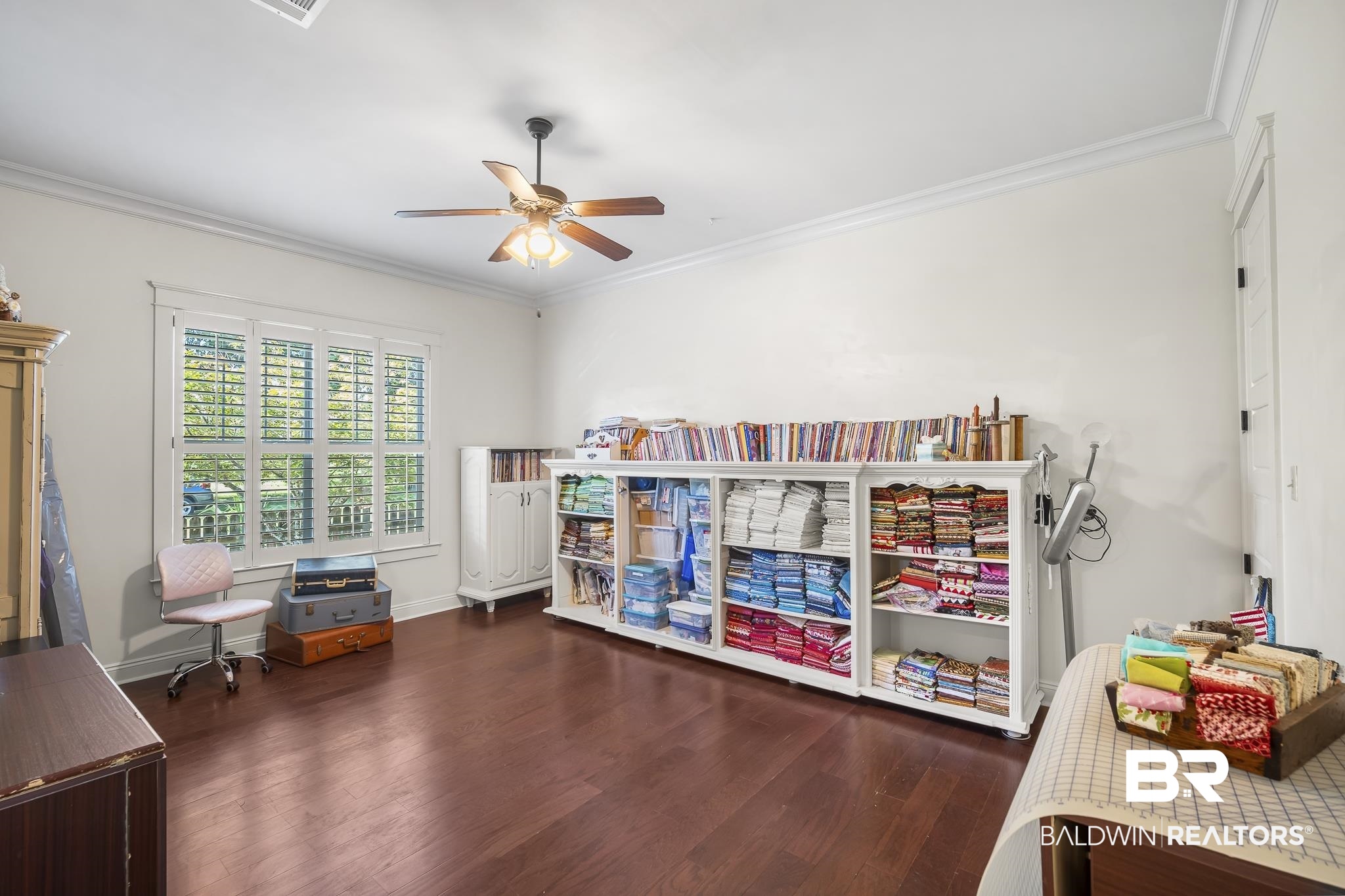 25212 Austin Road Daphne, AL 36526 - Photo 40 of 56 Room with crown molding, dark wood finished floors, and a ceiling fan
