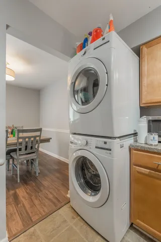 a utility room with sink dryer and washer