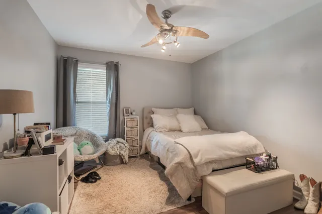a bedroom with a bed and window