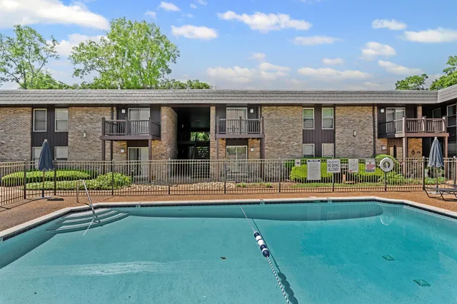 swimming pool view with outdoor seating