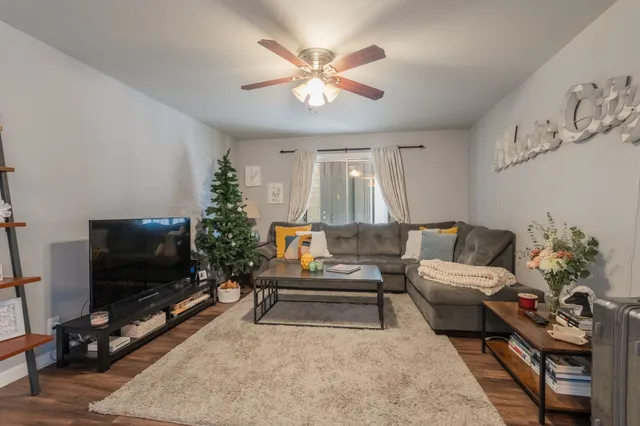 a living room with furniture and a flat screen tv